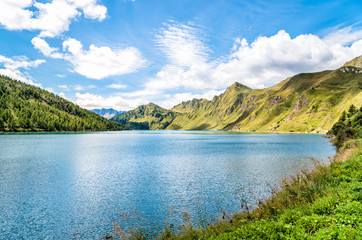 View of lake Ritom with the Alps in background, Piora, Canton Ticino of Switzerland 