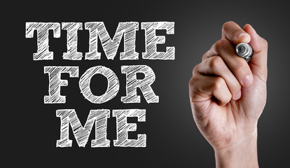 Hand writing the text: Time For Me