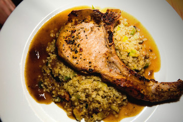 pork chop with rice in plate
