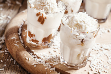 Coconut dessert with vanilla ice cream and caramel, selective fo