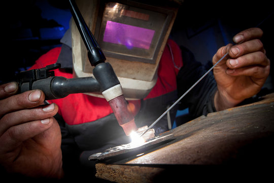 Worker Welding The Aluminium