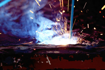 Welder working metal spark