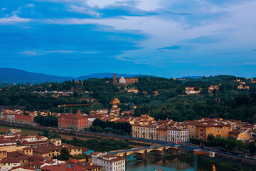 Fototapeta na wymiar Florence at night view. Mountains and river Arno. View from Basilica di Santa Croce. August 23, 2015