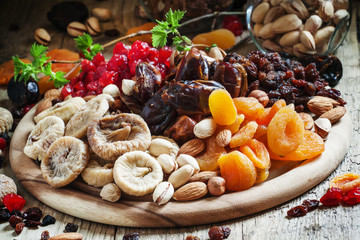 Mix dried fruits and nuts, healthy diet, eating lean, old wooden