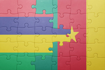 Fototapeta premium puzzle with the national flag of mauritius and cameroon