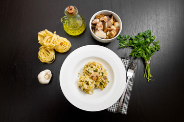 tagliatelle and mushrooms with fresh ingredients