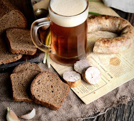 black bread, beer, onion, garlic and sausage, rustic dinner