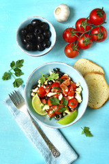 Tomato salad with feta cheese and olive.