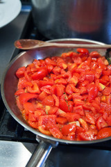Whole tomatoes on pan, red sauce