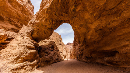 Tall Arch at Death Valley Wind and water did the bridge between the rocks. Natural bridge canyon trail, Death Valley