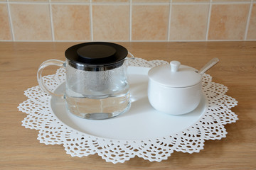 Glass tea kettle and sugar bowl