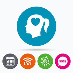 Head with heart sign icon. Female woman head