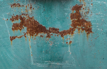 Old metal with green cracked paint. Vintage metal background. Abstract cracelures