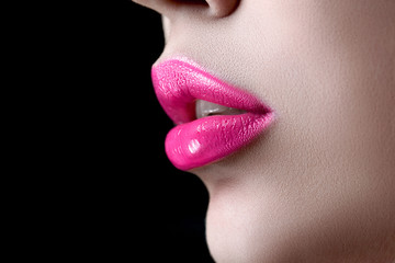 Closeup macro photo of pretty natural lips with pink glossy lipstick on black background. Ideal advertisment. Best quality - 106061650