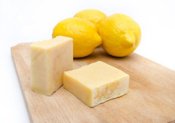 Traditional hand made lemon scented and extract soap on a wooden