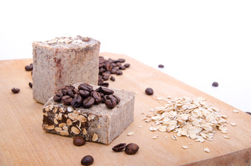 Traditional home made soap with coffee and rice suggesting natural cleaning cosmetyc product