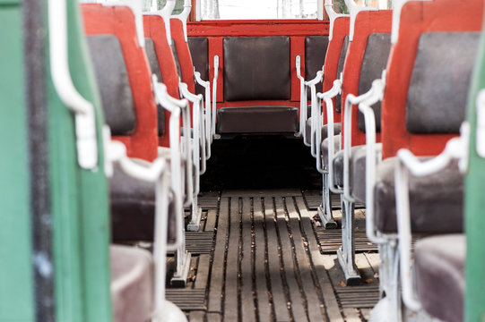 colorful interior seating on a vintage bus