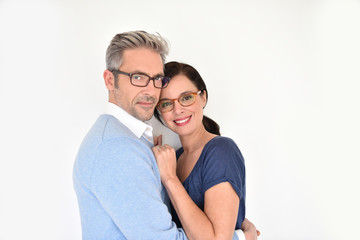Middle-aged couple with eyeglasses on white background