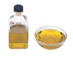 Extra virgin oil in bowl separated on white background