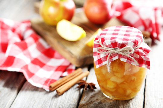 Apple Jam In Jar On A Grey Wooden Table