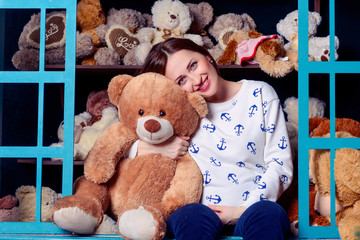 The pregnant woman hugging a teddy bear - 106063428