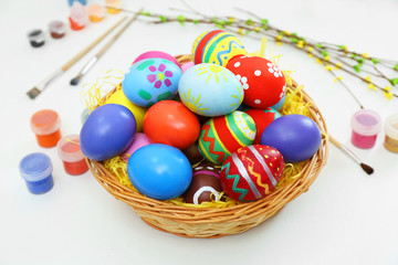Fototapeta na wymiar Colorful Easter eggs on white table closeup