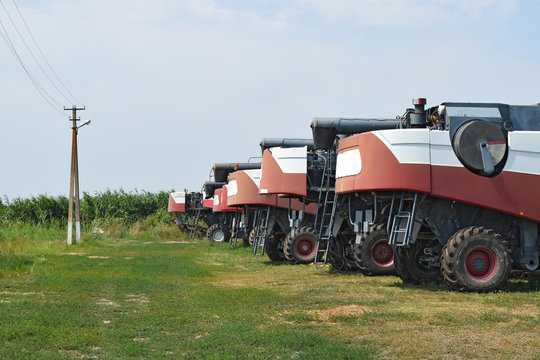 Combine harvesters, standing in a row. Agricultural machinery.
