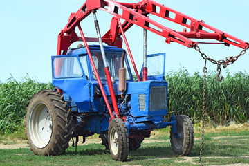 Fototapeta premium Tractor to collect hay