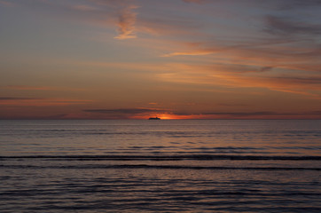 Fototapeta na wymiar Ferry Baltic sea at sunset on the horizon.