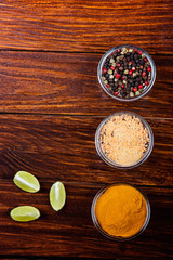 Aromatic spices on wooden background. Food ingradients.