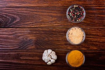 Aromatic spices on wooden background. Food ingradients.