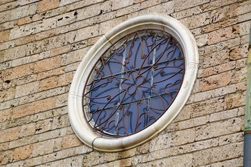 "Circular Window"
Close up of a grated circular window set into the stone exterior of a historic church in Sofia, Bulgaria