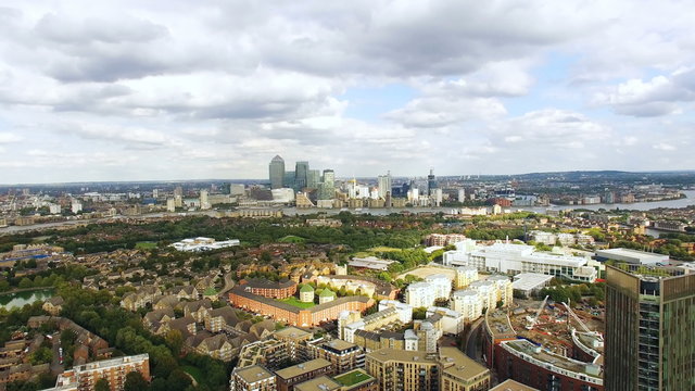 4K Aerial View Residential Houses Urban Scene and Business Finance Skyscrapers Cityscape of London Canary Wharf