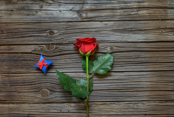 Single red rose with a Valentines gift