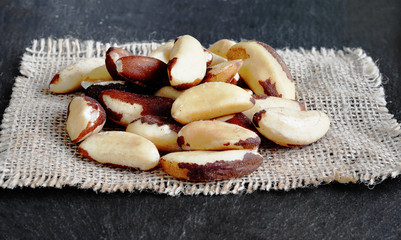 Brazil Nuts (close-up shot) on stone background. Bertholletia. 