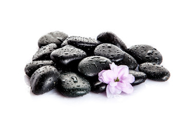 Fototapeta na wymiar background of a spa with stones. Zen pebbles and flower
