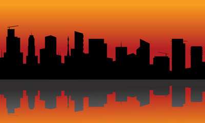 Fototapeta na wymiar Silhouette of city with orange background