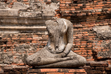 Fototapeta na wymiar Headless statue of buddha mediating, Ayutthaya