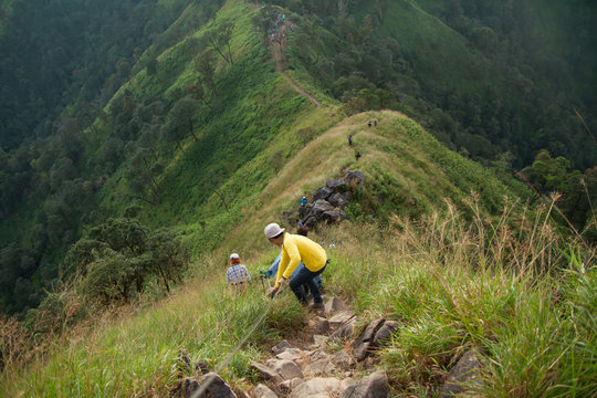 An Unidentified Tourism climbing on high mountain