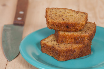 Homemade banana bread sliced on a table . rustic style