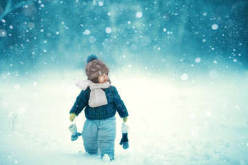 the kid walks in the snow