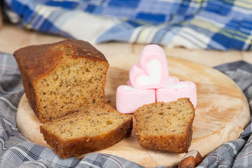 Homemade banana bread sliced on a table . rustic style