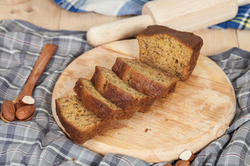 Homemade banana bread sliced on a table . rustic style
