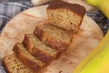 Homemade banana bread sliced on a table . rustic style