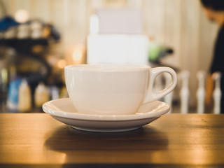 Coffee cup on wooden table, vintage