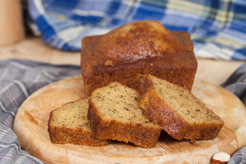 Homemade banana bread sliced on a table . rustic style