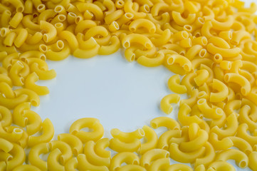 uncooked pasta on a white background