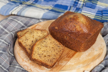 Homemade banana bread sliced on a table . rustic style