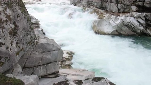 Crane Shot Up Rock Boulders to Raging Skykomish River at Eagles Falls
