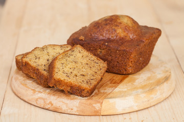 Homemade banana bread sliced on a table . rustic style